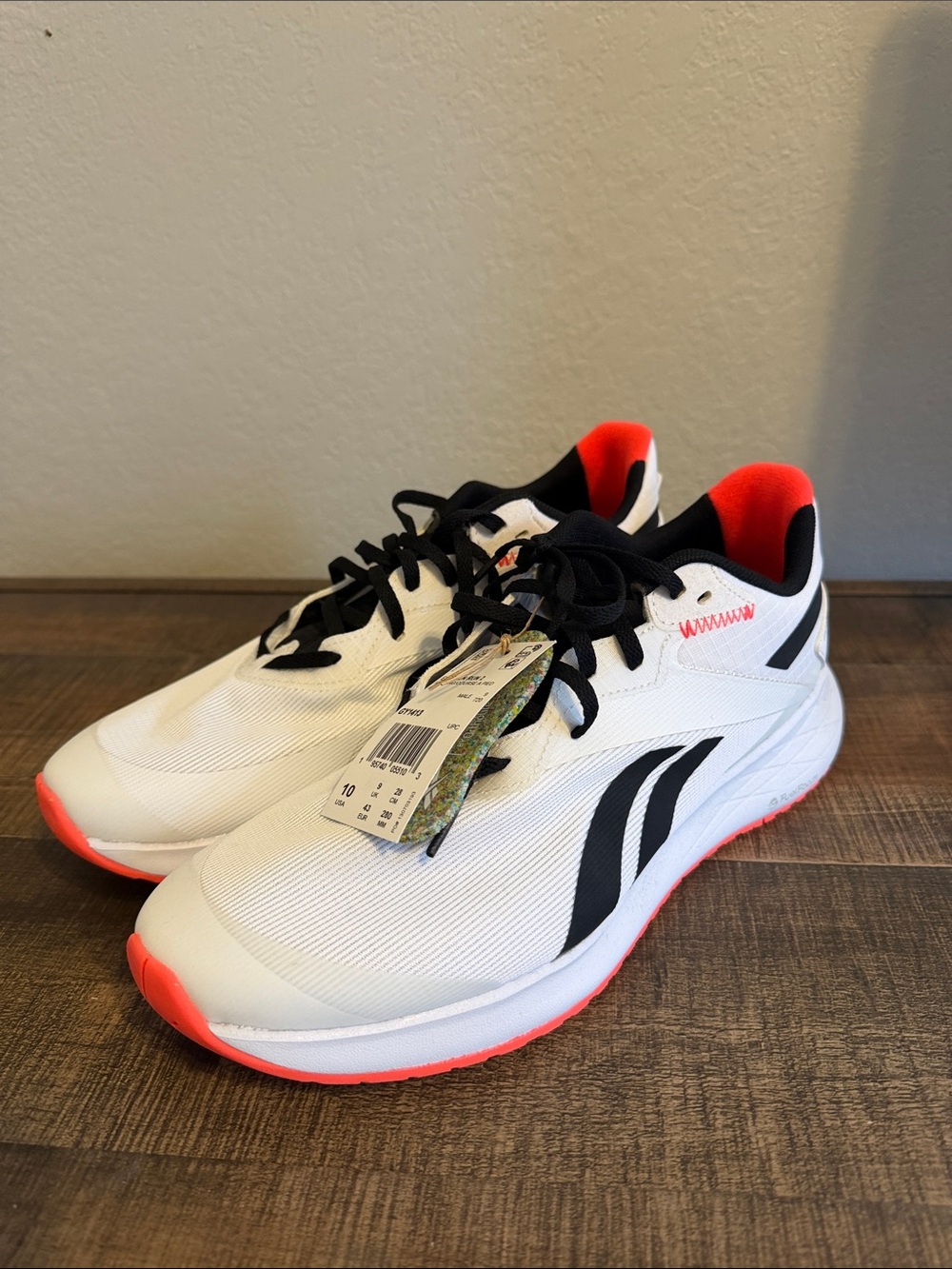 Reebok White Sneakers with Black Logos and Coral Highlights